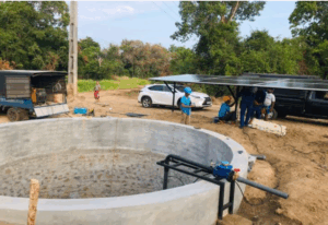 Solar pump installation site in Mahawewa, Manampitiya with Deep Tec team setting up panels and water system.